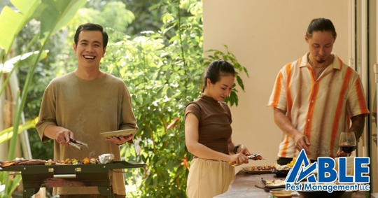 A group of friends enjoying barbecue outdoors